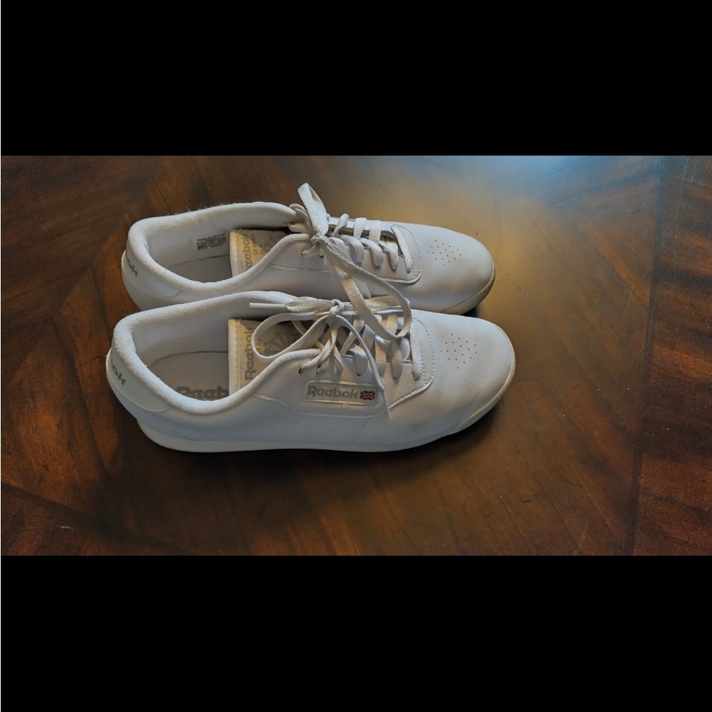 Women’s white Reebok.